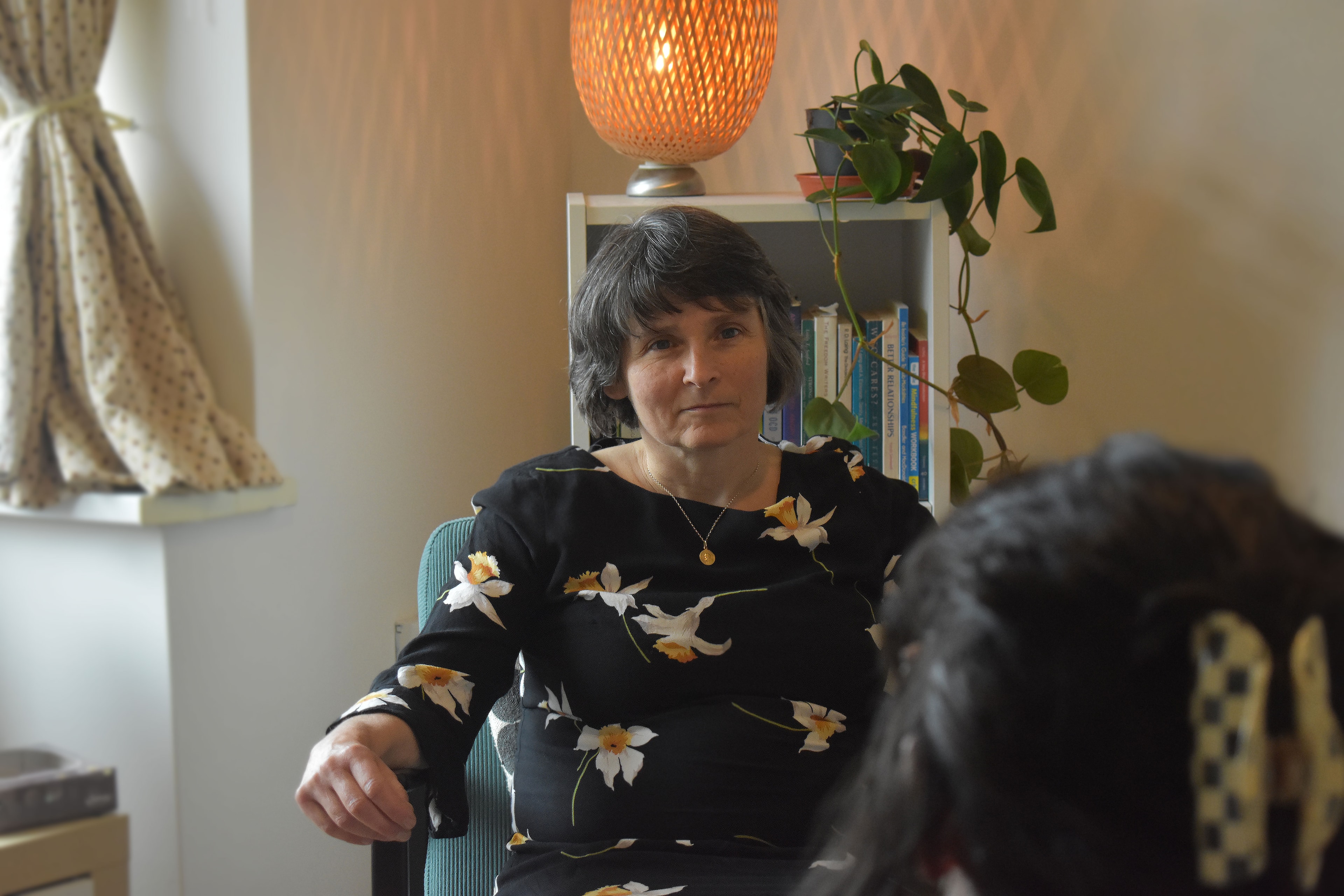 Helen Stone seated in her counselling room, listening